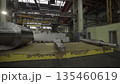 Large metal cylinders rotating in industrial factory. Stock clip 135460619
