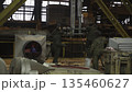 Industrial workers welding metal structure in factory. Stock clip 135460627