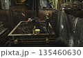 Foundry workers pouring molten metal into mold. Stock clip 135460630
