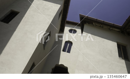 Majestic white building with intricate architecture under blue sky. Action 135460647