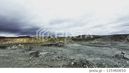Mining landscape showing eroded terrain and cloudy sky. Stock clip 135460650