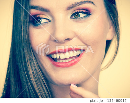 Smiling attractive woman with full makeup Smiling attractive woman with full makeup 135460915