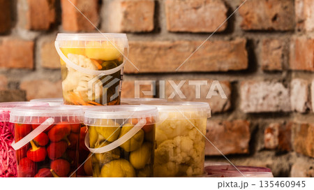 Jars with pickled vegetables in cellar 135460945