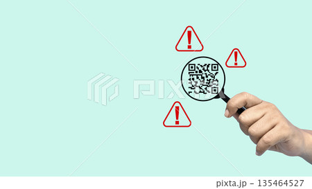 Hand holding a magnifying glass inspecting a QR code surrounded by red warning alert signs. Concept of quishing, cybersecurity, online fraud prevention, and scanning for malicious links 135464527
