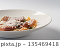 Farfalle pasta with pork coppa and parmesan cheese 135469418