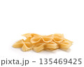 Italian dry farfalle pasta over white background with shadow top view 135469425