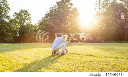 Family bonding. Happy family parenting moment outdoors. Family bonding. Happy family parenting moment outdoors. 135469714