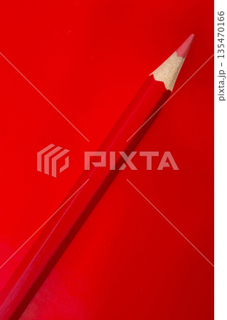 Red pencil on a red background 135470166