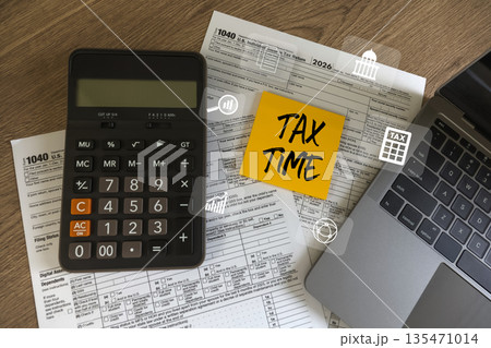 Tax time and income tax return deduction planning concept, calculator 1040 paperwork on desk, professional prepares Calculation tax return, checks budget, and meets filing deadline. 135471014