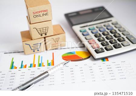 Online shopping, Shopping cart box on business graph, import export, finance commerce. 135471510