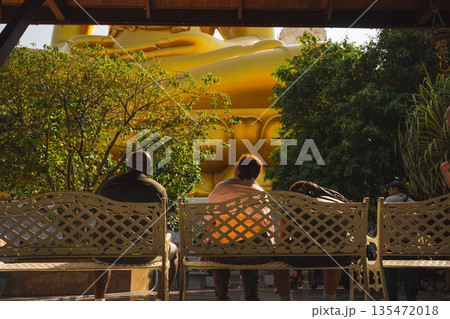 asia travel with people travel and take picture with large buddhist and beautiful temple with river at Bangkok Thailand in summer season 135472018