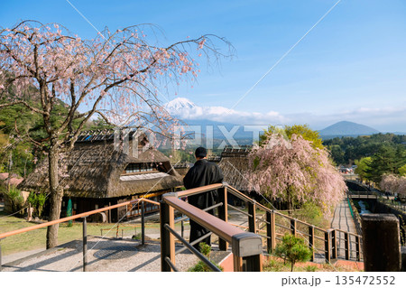 Japanese man in yukata view  Saiko Iyashi village with mt. Fuji 135472552