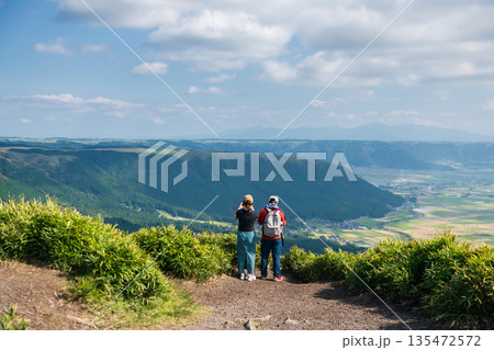 couple view and photograph at Daikanbo observatory summit, Kumamoto 135472572