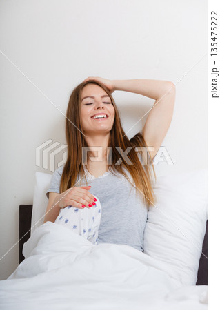 Girl yawning in bed. Girl yawning in bed. 135475222