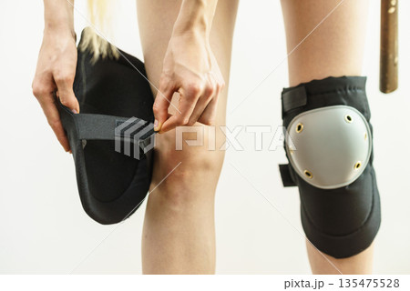 Person trying on knee pads 135475528