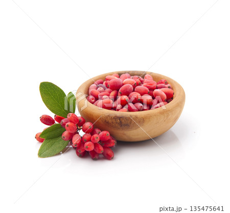 Barberry in wooden plate on white backgrounds Barberry in wooden plate on white backgrounds 135475641