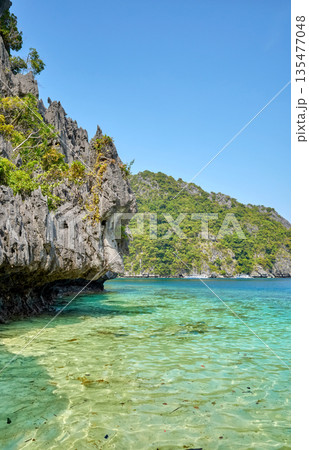 Rocky cliffs of tropical islands in the Philippines. 135477048