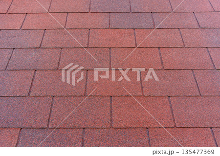 Red Bituminous Roof Shingle Texture Background with Granular Surface Red Bituminous Roof Shingle Texture Background with Granular Surface 135477369