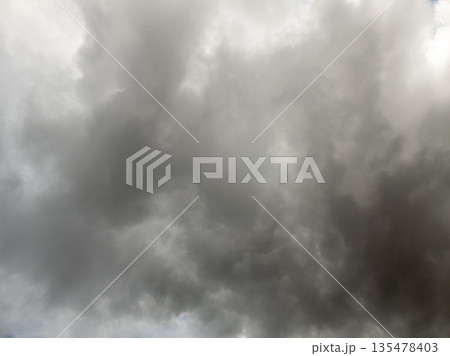 Ominous storm clouds in dark gray sky during daytime Ominous storm clouds in dark gray sky during daytime 135478403