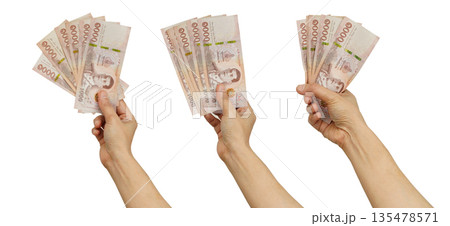 Asian woman holding mobile smartphone in hand for communication isolated on white background. 135478571