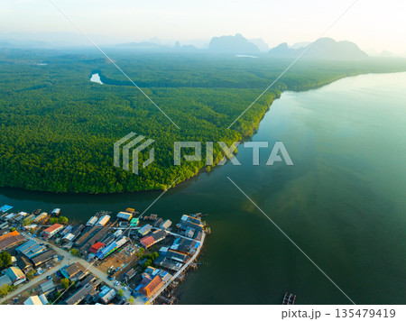 Aerial view top view of the fisherman village with fishing boats and house roof at the pier in Phangnga Thailand, Panorama high angle view 135479419