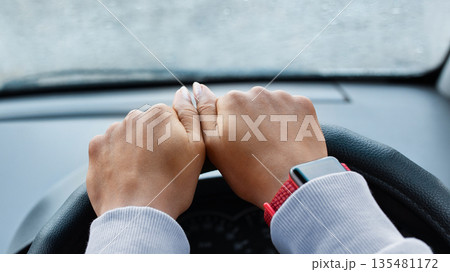 Modern woman driver and searching road by gps map. Hands of young african american lady with smart watch on steering in car with smartphone with empty screen in rainy weather, pov, free space, cropped Modern woman driver and searching road by gps map. Hands of young african american lady with smart watch on steering in car with smartphone with empty screen in rainy weather, pov, free space, cropped 135481172