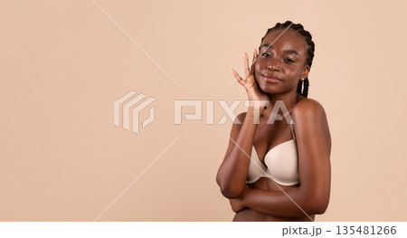 Attractive Young African American Woman With Fit Body Posing In Underwear, Beautiful Black Millennial Female In Lingerie Standing Isolated Over Beige Background, Enjoying Her Beauty, Copy Space Attractive Young African American Woman With Fit Body Posing In Underwear, Beautiful Black Millennial Female In Lingerie Standing Isolated Over Beige Background, Enjoying Her Beauty, Copy Space 135481266
