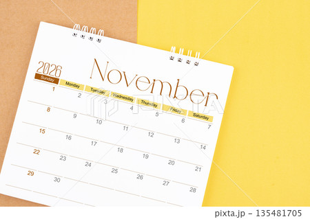 November 2026 desk calendar on brown and yellow, Planning for business. 135481705