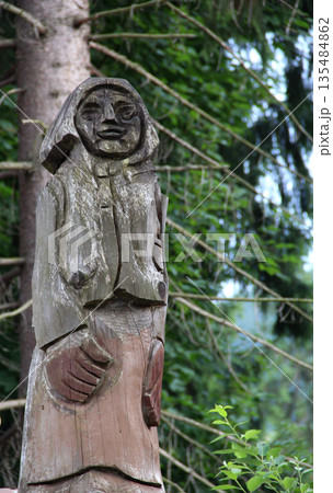 Ancient Female Wooden Idol In Forest Detailed Photo Ancient Female Wooden Idol In Forest Detailed Photo 135484862