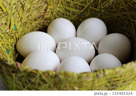 Chicken Eggs In A Hand Craft Grass Basket Detailed Stock Photo Chicken Eggs In A Hand Craft Grass Basket Detailed Stock Photo 135485324