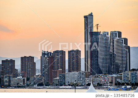 Beautiful sunset over the city of Benidorm, Valencian Community, Alicante province. Cityscape 135485716