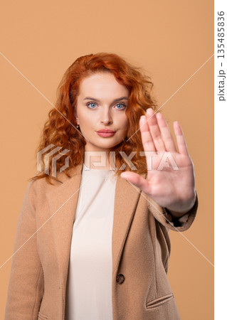 Ginger Businesswoman With Palm In Stop Gesture, Clear Assertive Body Language 135485836