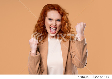 Happy Businesswoman Victory Gesture Yes, Clenched Fist, Joy Triumph Expression  135485845