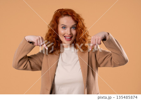 Young Businesswoman Blogger Pointing Below, Advertising Adds. Click To Subscribe 135485874