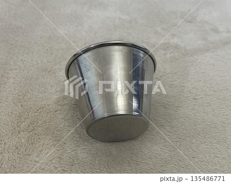 measuring cup isolated on gray background 135486771