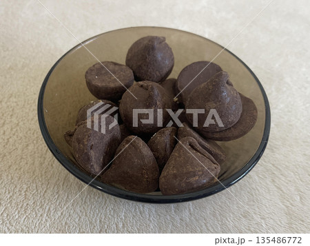 bowl of sweets isolated on gray background bowl of sweets isolated on gray background 135486772