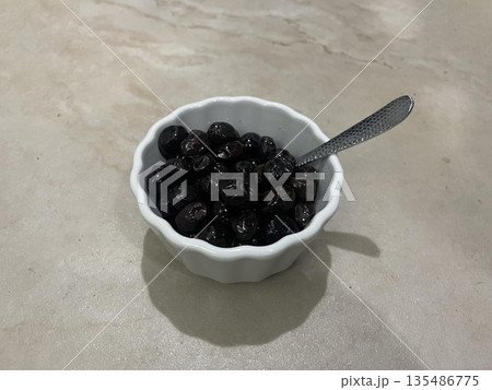 olives bowl isolated on gra table olives bowl isolated on gra table 135486775