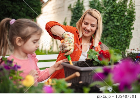 Celebrating joy in gardening with family at home 135487501