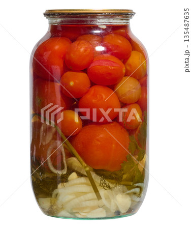 Glass jar with canned red tomatoes on isolated background 135487635