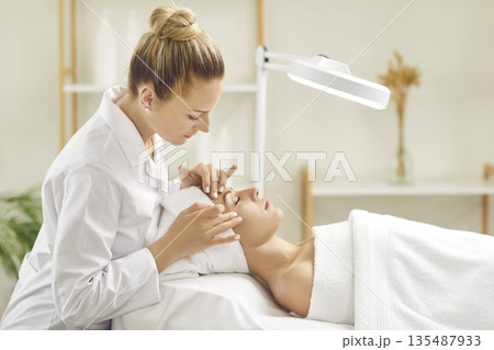 Dermatologist Performs Facial Treatment in Salon Dermatologist Performs Facial Treatment in Salon 135487933