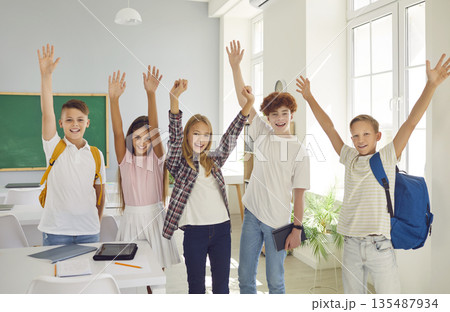 Group Portrait Of Happy Schoolchildren In Classroom Group Portrait Of Happy Schoolchildren In Classroom 135487934