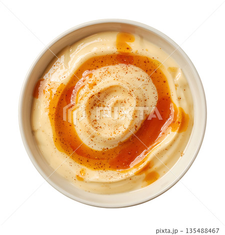 Creamy Sauce in a Round White Bowl on a Plain Surface Ready for Serving With Food 135488467