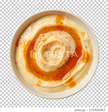 Creamy Sauce in a Round White Bowl on a Plain Surface Ready for Serving With Food 135488467