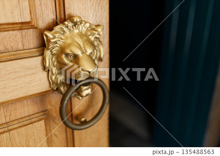 Metal Ring Door Handle on Old Wooden Door Metal Ring Door Handle on Old Wooden Door 135488563