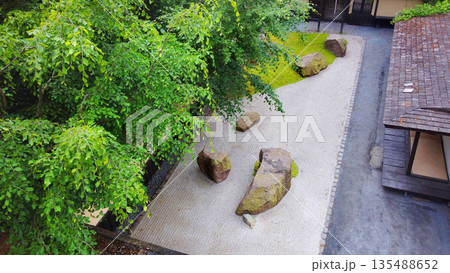 Japanese rock garden in Odense with green grass ,local variant and very large rocks on it and small white pebbles Japanese rock garden in Odense with green grass ,local variant and very large rocks on it and small white pebbles 135488652