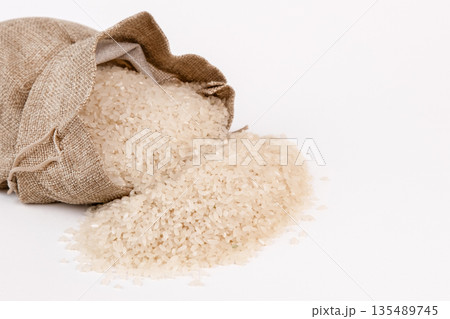 Rice in a cloth bag on a white background Rice in a cloth bag on a white background 135489745