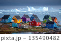 Colorful Arctic Village on Rocky Shore with Icebergs 135490482