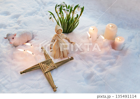 Imbolc brigid's cross and corn dolly ritual in snow 135491114