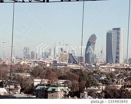 Modern skyline of Milan CityLife district with iconic skyscrapers and cranes Modern skyline of Milan CityLife district with iconic skyscrapers and cranes 135491643