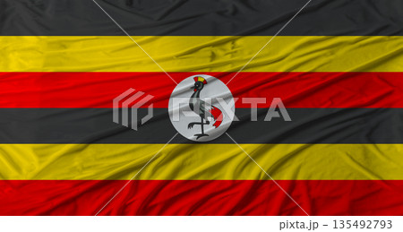 Ugandan flag waving. Flag of Uganda with cloth texture Ugandan flag waving. Flag of Uganda with cloth texture 135492793